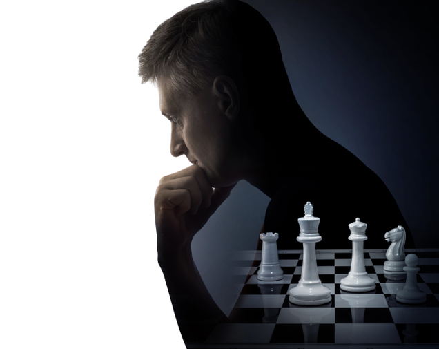 man thinking over chess board