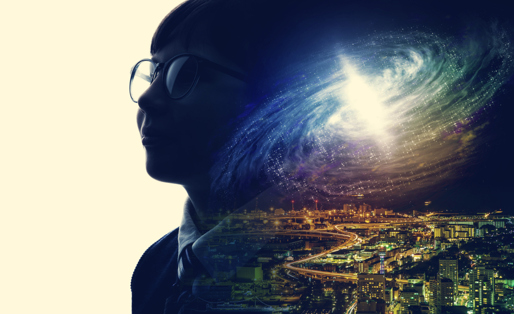 silhouette of person and nightime city sky