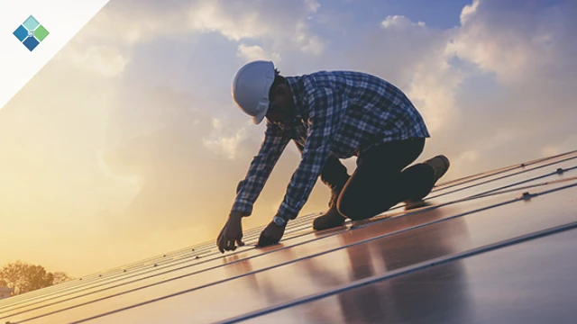 Field service technician performing maintenance on solar panels