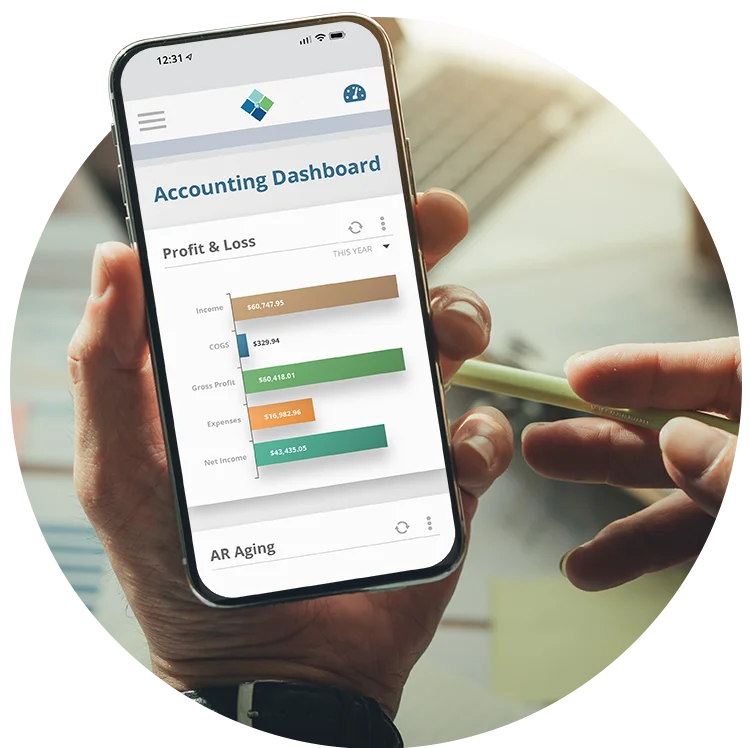 Business person holds a phone with Striven Profit & Loss widget on the Accounting dashboard