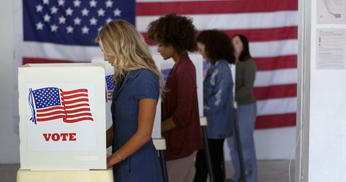 women at voting booth